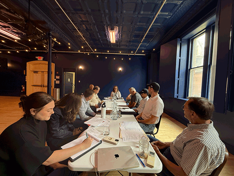 people sitting around a table in the Blue Room